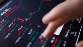 Close-up Person Analyzing Stock Market Graph on Digital Tablet Touch Screen. Businessman Checking Stock Market Data. Hand Gesture on Digital Tablet for Analyzing Stock Market. Forex Crypto Currency. - Powered by Shutterstock - Get 15% off with code: PIKWIZARD15