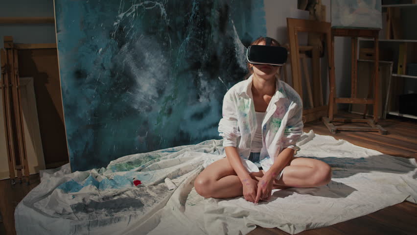 An Artist Uses VR to Immerse Himself in a Virtual Studio, Creating and Exploring New Artistic Worlds. Combines Traditional Art Techniques with Modern Digital Tools in an Innovative Virtual Environment