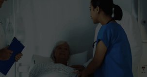 male doctor and female doctor consulting patient in hospital room, with animated medical charts. Medical, healthcare, technology, diagnostics, clinical, documentation, innovation - Powered by Shutterstock - Get 15% off with code: PIKWIZARD15