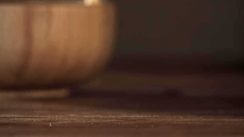 Cashews fall on a wooden table. Filmed on a high-speed camera at 1000 fps. High quality FullHD footage