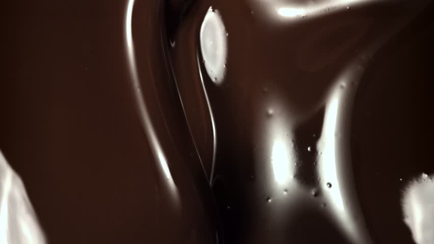 Melted liquid chocolate. Filmed on a high-speed camera at 1000 fps. High quality FullHD footage