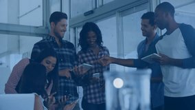Tech team collaborating with laptop and phones in modern office, showing floating music note icons. Technology, teamwork, innovation, digital, modern, communication, networking - Powered by Shutterstock - Get 15% off with code: PIKWIZARD15