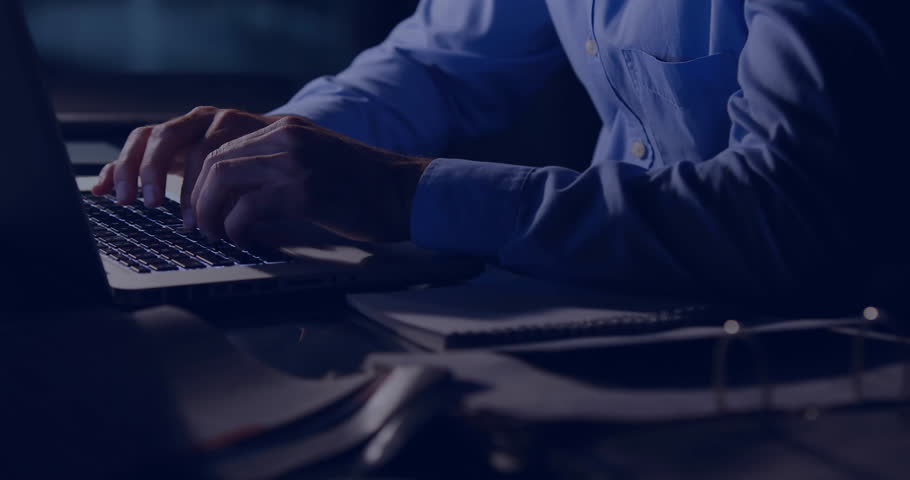 Man holding eyeglasses interacting with holographic graphs and maps above laptop on technology desk. Futuristic, innovation, data visualization, digital, technology, productivity, sleek