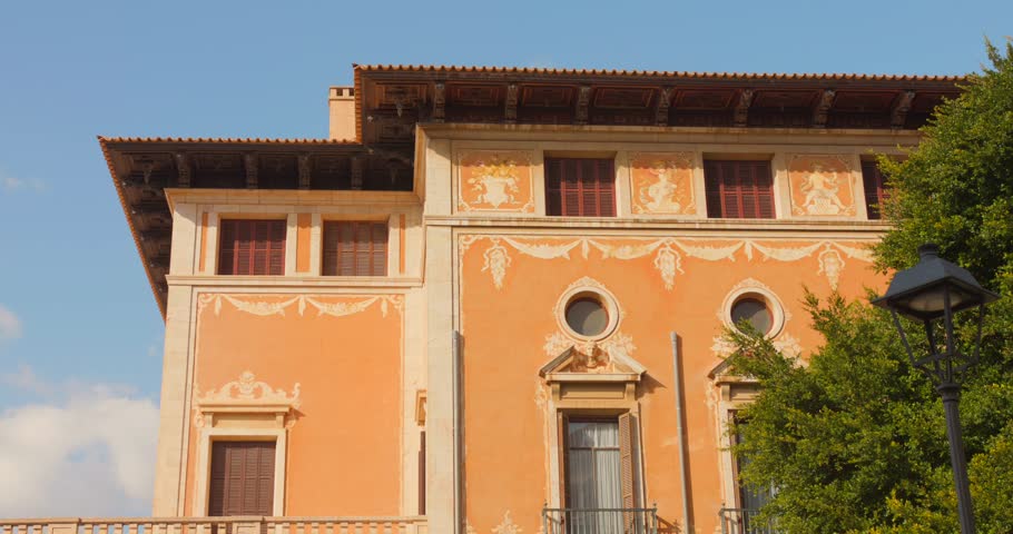 Sunny exterior shot of ornate building in Palma de Mallorca’s old town