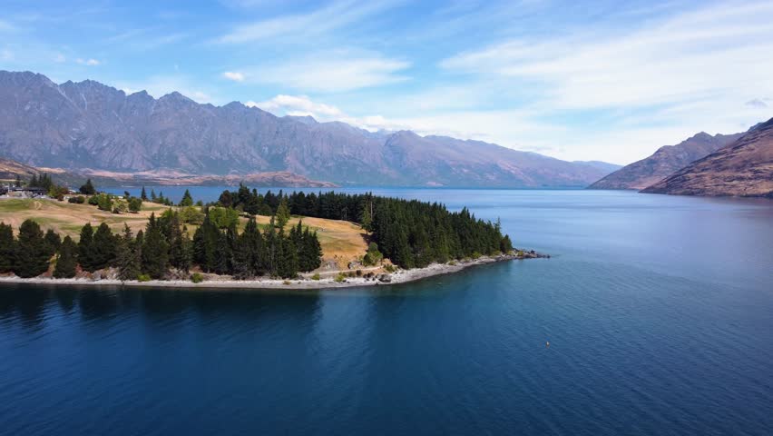 AERIAL Shot of Lake Wakatipu and Golf Fields in Queenstown, New Zealand