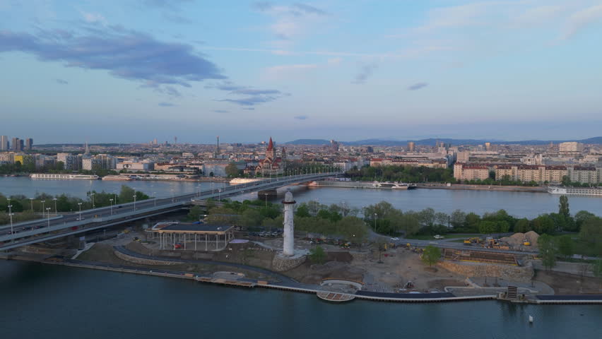 Explore breathtaking aerial views of Vienna, Austrias capital, highlighting the picturesque Danube River and its iconic cityscapes and landmarks that showcase the citys unique charm
