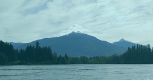 Snow-capped mountain being visualized in lake, overlaying transparent line graphs and bar charts. Landscape, finance, data, visualization, technology, analytics, natural - Powered by Shutterstock - Get 15% off with code: PIKWIZARD15