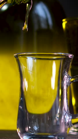 Oil in bottles. Industrial production of sunflower oil. Conveyor line for bottling and packing. Sunflower oil plant.