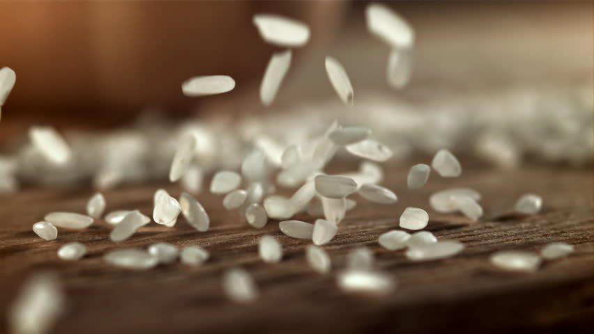 Rice falls on the table. Filmed on a high-speed camera at 1000 fps. High quality FullHD footage