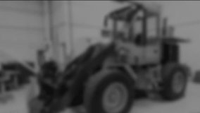 Blurred mechanic leaning over car engine bay, displaying JavaScript code overlay in flat design. Automotive, technology, engineering, digital, industrial, innovation, workspace - Powered by Shutterstock - Get 15% off with code: PIKWIZARD15