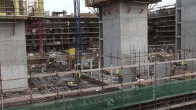 Concrete support column standing with scaffolding connecting network icons in building infographic. Construction, industrial, engineering, teamwork, progress, infrastructure, safety - Powered by Shutterstock - Get 15% off with code: PIKWIZARD15