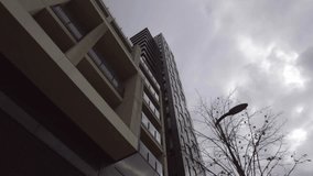 Showing high-rise building linking user icons with network lines under cloudy sky using flat design. Skyscraper, connectivity, technology, urban, architecture, infrastructure, professional - Powered by Shutterstock - Get 15% off with code: PIKWIZARD15