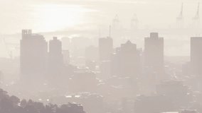 Visualizing audio data flowing over misty urban skyline, with stylized waveforms and cranes. Cityscape, industrial, digital, abstract, skyline, technology, urban - Powered by Shutterstock - Get 15% off with code: PIKWIZARD15