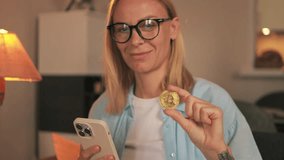 Confident businesswoman engaging with bitcoin and smartphone, demonstrating cryptocurrency investment potential and digital financial innovation.Successful trading, cryptocurrency, crypto currency, - Powered by Shutterstock - Get 15% off with code: PIKWIZARD15