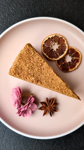 A slice of honey puff cake or pumpkin, carrot and cream pie, vegan sweets for the dinner table