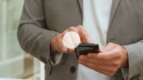 Businessman tapping smartphone in office, with floating connectivity icons showing IoT network. Technology, innovation, networking, digital, connectivity, professional, modern - Powered by Shutterstock - Get 15% off with code: PIKWIZARD15