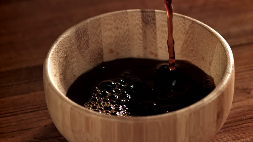 Soy sauce is poured into a gravy boat. Filmed on a high-speed camera at 1000 fps. High quality FullHD footage