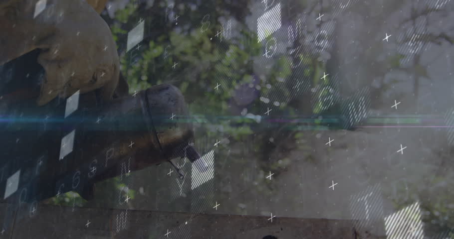 power washer nozzle spraying water outdoors, yellow hard hat resting near finance charts overlaying. Industrial, technology, durability, efficiency, outdoor, machinery, data