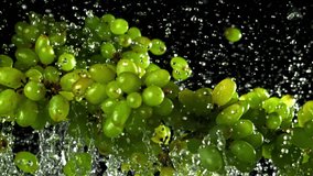 Green grapes fly up and fall down. Filmed on a high-speed camera at 1000 fps. High quality FullHD footage - Powered by Shutterstock - Get 15% off with code: PIKWIZARD15