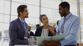 Business professionals reviewing binder on high table, viewing digital network icons floating. Collaboration, teamwork, professionalism, modernoffice, communication, connectivity, corporate - Powered by Shutterstock - Get 15% off with code: PIKWIZARD15