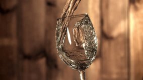 White wine is poured into a glass. Filmed on a high-speed camera at 1000 fps. High quality FullHD footage - Powered by Shutterstock - Get 15% off with code: PIKWIZARD15