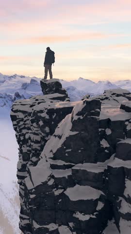 3D Rendering of Hiker on Snowy Mountain Peak at Sunset