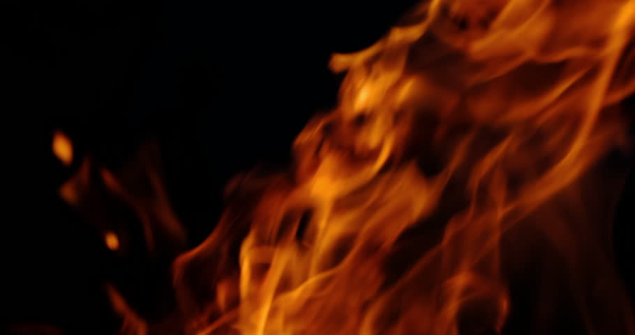 a campfire burning at night