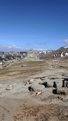 Unique rock formation known as “Babele” located in the Bucegi Mountains, Romania. This natural stone structure, shaped by centuries of wind and weather erosion, stands on a rugged plateau 