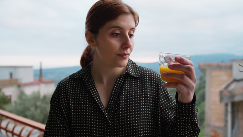 Italian Woman Drinks Orange Carrot Juice To Take Vitamins In The Morning 