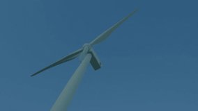 3D wind turbine rotor spinning over blue financial chart with green line graph and candlestick bars. Renewable, finance, technology, sustainability, analytics, innovation, urban - Powered by Shutterstock - Get 15% off with code: PIKWIZARD15