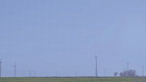 Data visualization being animated over wind farm, showing bars, candlesticks, trend lines. Renewable, sustainability, technology, analytics, environment, eco-friendly, innovation - Powered by Shutterstock - Get 15% off with code: PIKWIZARD15