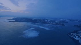 Flat design aerial coastal island showing floating candlestick charts and numeric overlays at dusk. Abstract, analytics, data visualization, oceanic, modern, technology, dashboard - Powered by Shutterstock - Get 15% off with code: PIKWIZARD15
