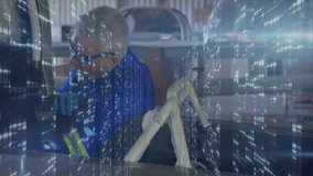 Mechanic inspecting car interior in auto workshop, with animated wiring diagram and data overlay. Industrial, technical, engineering, machinery, innovation, precision, technology - Powered by Shutterstock - Get 15% off with code: PIKWIZARD15