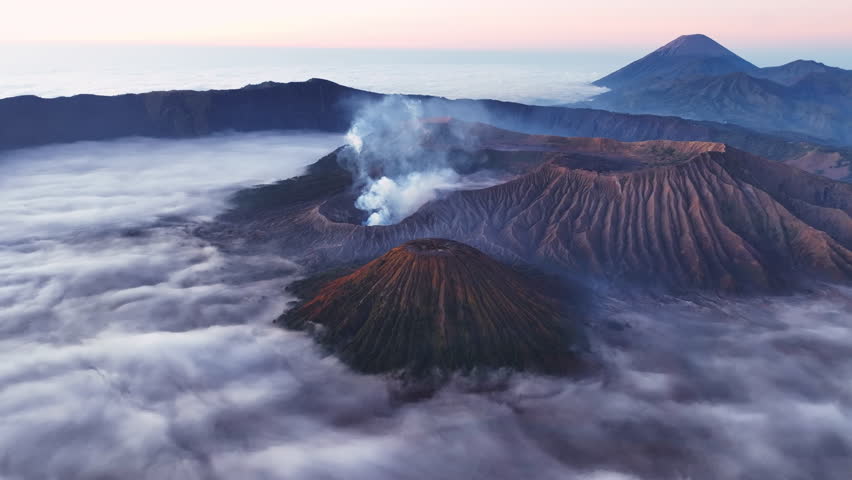 Aerial view of Amazing Mount Bromo volcano during sunrise sky,Beautiful Mountains Penanjakan in Bromo Tengger Semeru National Park,East Java,Indonesia.Nature landscape background,High quality video