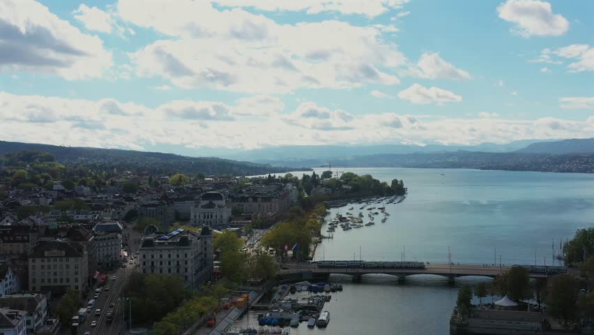 An Aerial shot of the Zurich old town along the Limmat river and lake Zurich on a sunny day in Switzerland
