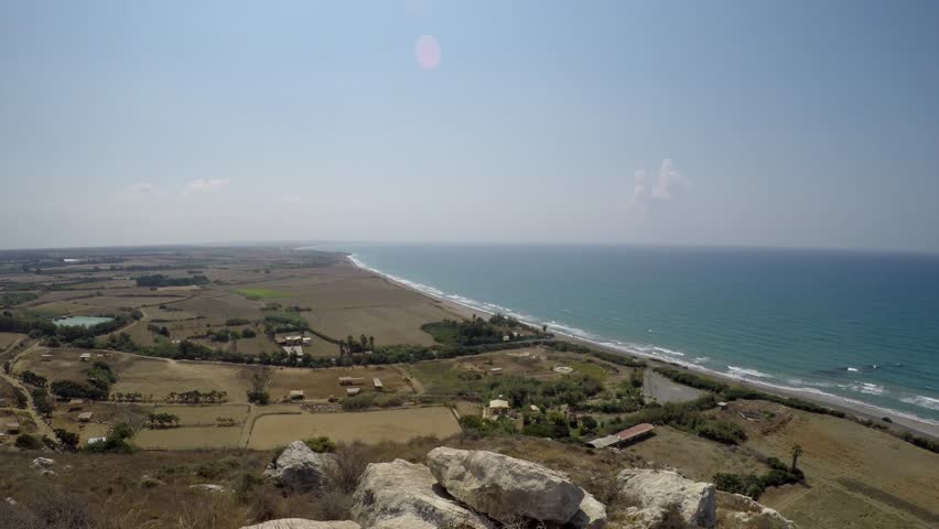 Panoramic aerial shot of the Kourion Archaeological Site, Cyprus, overlooking the coastline