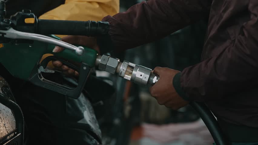 Close Up of Motorcycle Refueling at Gas Station