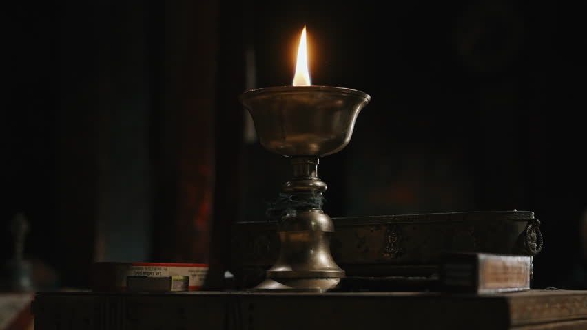 Brass Oil Lamp Burning in Buddhist Temple