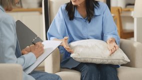 Asian Concerned woman talks with mental health professional Advice, discussion or woman in therapy, counselling or consultation for mental health  mental health counselling from a female therapist. - Powered by Shutterstock - Get 15% off with code: PIKWIZARD15