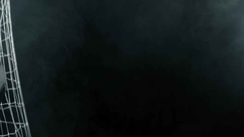 Super Slow Motion Soccer Ball Hitting Goal Net on Black Background, 1000fps.