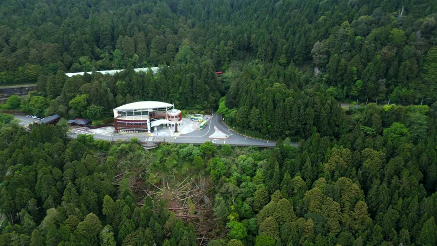 Aerial view of green Alishan National Forest Recreation Area in Chiayi County,Taiwan. Wide shot. Green trees and forest landscape.