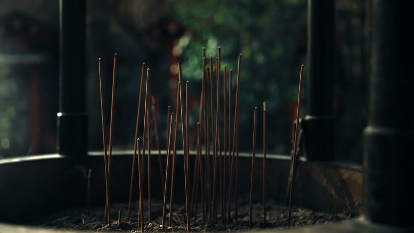 Close-up of Burning Incense Sticks in a Buddhist Temple, Japan