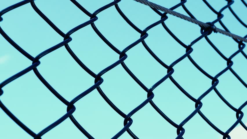 Metallic wire in the fence.
