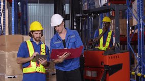 Logistics team including multicultural workers collaborate to check pallets, reinforcing teamwork in industrial warehouse setting. - Powered by Shutterstock - Get 15% off with code: PIKWIZARD15