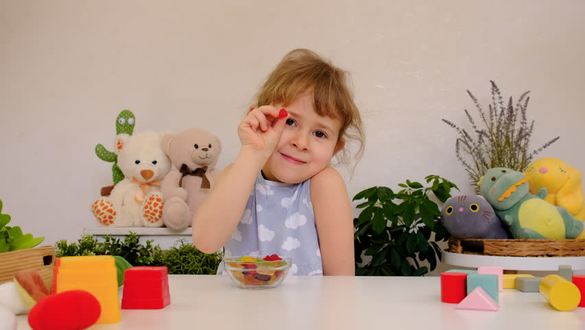 Child with jelly candies. Selective focus.