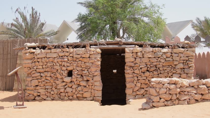 Emirates heritage village display of traditional stone house in Abu dhabi, UAE. Tilt up view