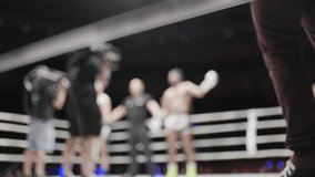 Boxer wins muay thai fight and raises arms in victory - Powered by Shutterstock - Get 15% off with code: PIKWIZARD15