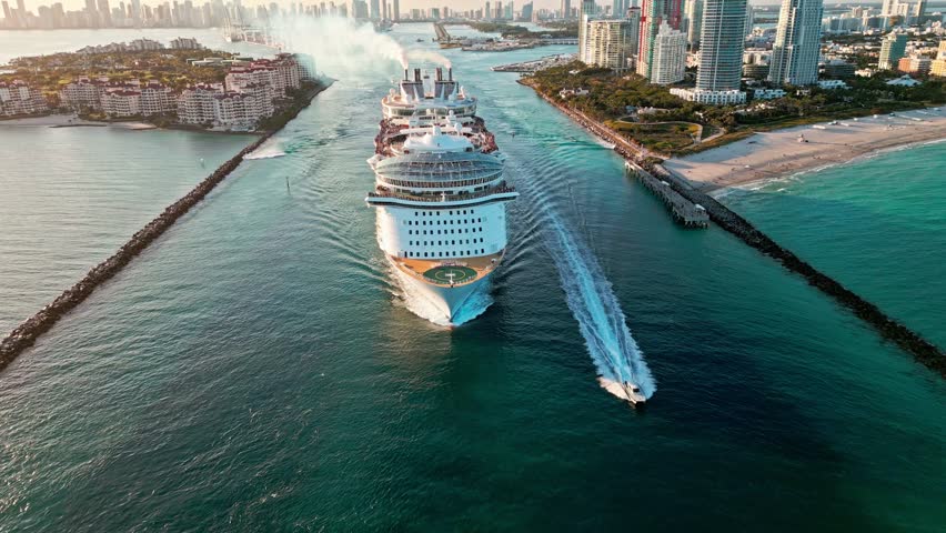 Aerial view of cruise in summer vacation. Cruise ship tour and travel at sea. Aerial view of luxury liner voyage. Ship leaving Miami beach port. Miami tour. Cruise ship voyage. Miami canal