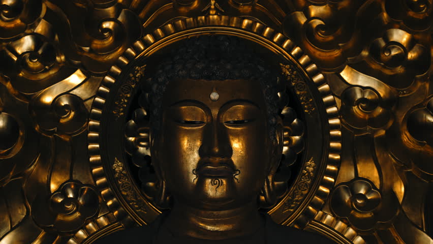 Golden buddha statue inside a buddhist temple in Kyoto, Japan