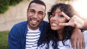 Happy African couple smiling on camera at park city. Friends enjoy summer vacation day. Youth culture, outdoors life style. Focus on man face - Powered by Shutterstock - Get 15% off with code: PIKWIZARD15